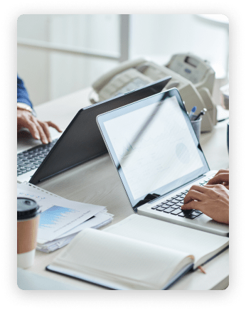 side-view-cropped-unrecognizable-business-people-working-common-desk 1